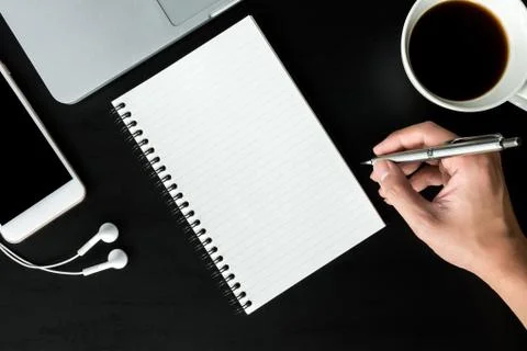 Man is going to write something on the notebook page. Top view with copy spac Stock Photos