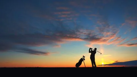 Man golf player hit ball to air silhouetted Stock Illustration