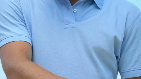 Man in golf uniform developing elbow feeling pain and cramp, joint problems 스톡 동영상 114346561