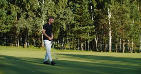 A man golfer plays on the field. Time for golf Stock Footage 220658583