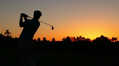 Man Golfing At Sunset, Silhouette Slow Motion Shot Stock Footage