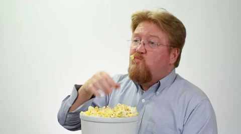 Man Gorging On Popcorn Stock Footage 46029468
