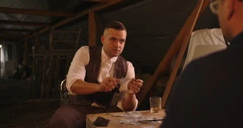 The man gots bad card combination . He takes his gun and targeting other person  Stock Footage 117671897