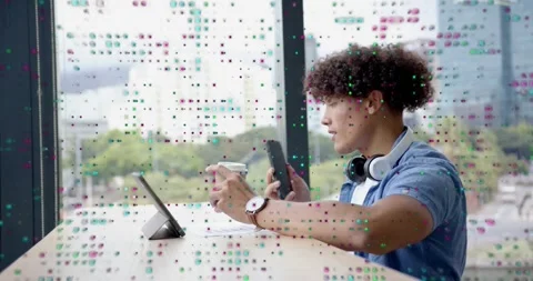 Man grabbing coffee smartphone in tech office scrolling tablet UI icons then Stock Footage 318607736