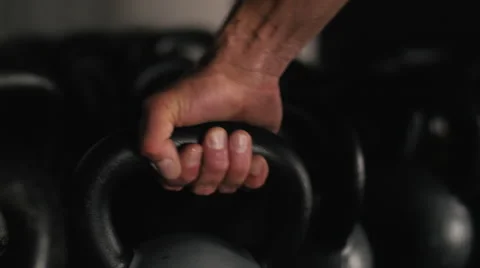 Man Grabs Kettlebell Stock Footage 42240328