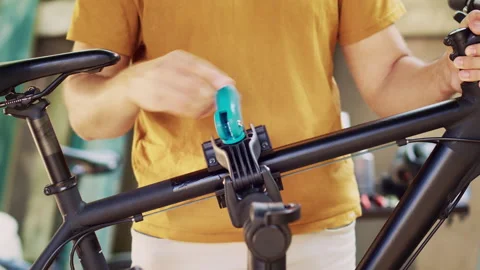 Man grasping damaged bicycle in yard Stock Footage 250048396