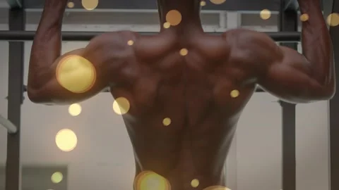 Man grasping pull-up bar and doing pull-ups for fitness, gaining strength amid Stock Footage 323431255