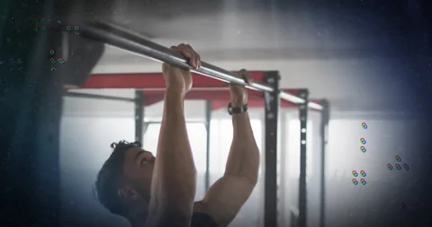 Man grasping pullup bar pulling chin up for fitness while glitch overlays Stock Footage 314737391