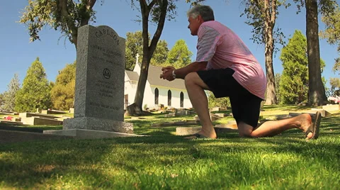 MAN AT GRAVESITE Stock Footage 28837088
