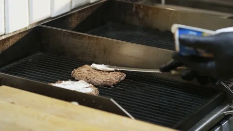 Man Greasing Meat on a Grill Stock Footage 71566365