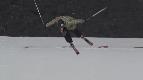 Man in green camouflage skiing - version 5. Stock Footage 81882446