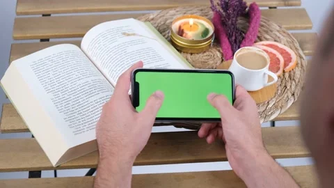 Man green screen phone playing game and coffee Stock Footage 236385338