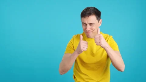 Man greeting someone while raising a thumb up and clapping Stock Footage 242942525