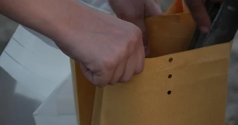 Man in Grey Uniform Puts Soil Samples, Gotten to Explore the Level of Oil Stock Footage 53081832