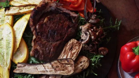 Man grilling and flipping steak and vegetables on the grill close-up 스톡 동영상 280479417