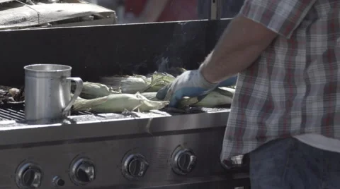 Man Grilling Corn Stock From Behind Cinematic 스톡 동영상 47461250