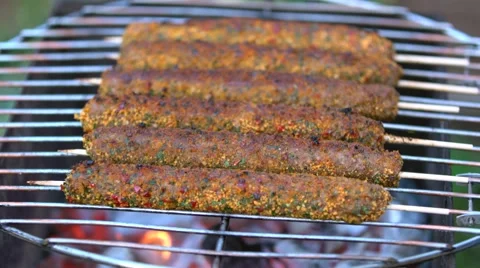 Man grilling kebab on barbecue Stock Footage 58730103