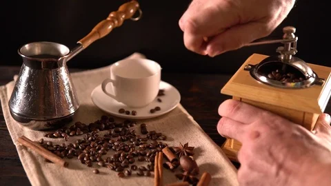 Man grinding coffee beans for fresh coffee Stock Footage 94462865