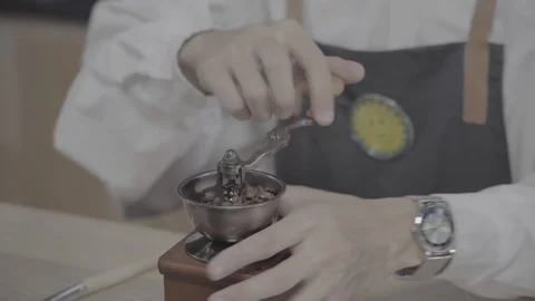 Man grinding coffee in coffee mill horizontal Stock Footage 120492290
