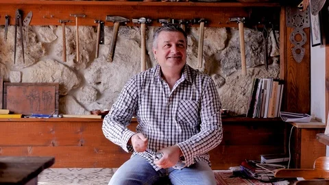 A man grinding coffee in a hand grinder. he opened it and looked inside Stock Footage 124433332