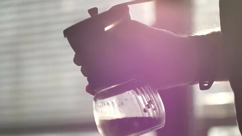 Man grinding coffee in the kitchen.	 Stock-Footage 139152599