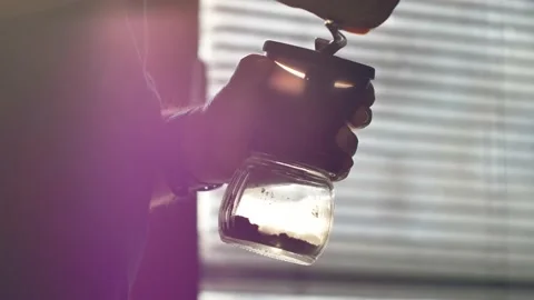 Man grinding coffee in the kitchen.	 Stock-Footage 139152791