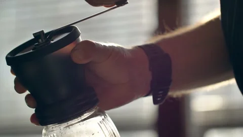 Man grinding coffee in the kitchen.	 스톡 동영상 139152943