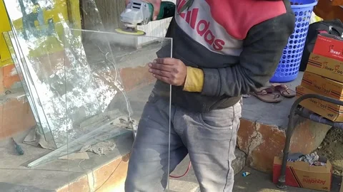 A man is grinding the glass with a machine. Stock Footage 146227149