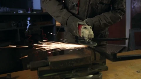 A man grinding in his workshop. Close up. High definition video Video stock 88353219