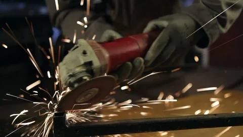 A man grinding in his workshop. Close up. High definition video. Stockbeeldmateriaal 88353324