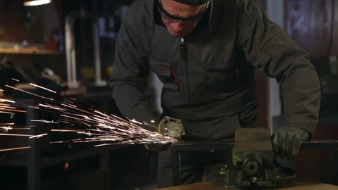 A man grinding in his workshop. Close up. High definition video. Stock Footage 88358243