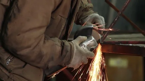 Man grinding a metal in workshop Stock Footage 72068115