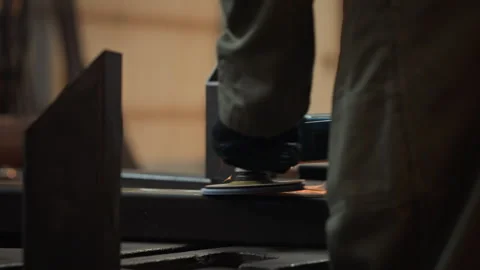 Man Grinding Steel Structure with Angle Grinder in Workshop Stock Footage 342499449