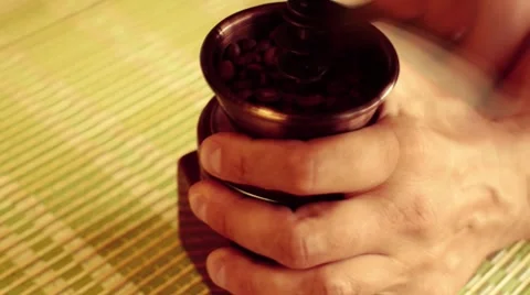 Man grinds coffee beans on the coffee mill Video stock 64272935