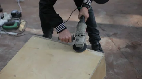 Man grinds constructions of wood Stock Footage 59241389