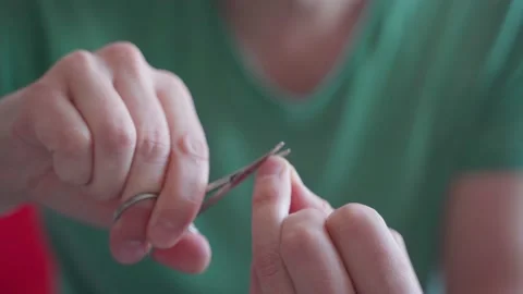 Man grinds his nails and does a manicure Stock Footage 165240226
