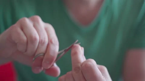 Man grinds his nails and does a manicure Stock Footage 178886816