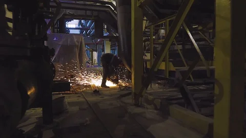 Man grinds metal Stock Footage 106881478
