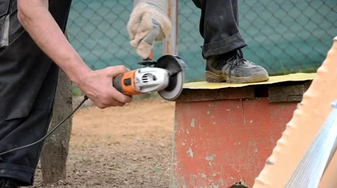 Man grinds a piece of iron Stock Footage 43258245