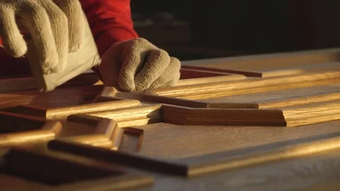 The man grinds wood. The joiner processes wooden boards. Stock Footage 76276196