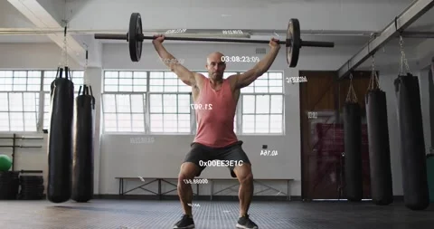 Man gripping barbell executing clean press and overhead squat for strength with Stock Footage 317858619