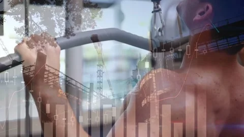 Man gripping lat-pulldown bar and doing reps for fitness while cranes and charts Stock Footage 331701383