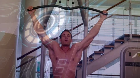 Man gripping lat pulldown bar and starting pull in home gym, HUD overlay Stock Footage 332592071
