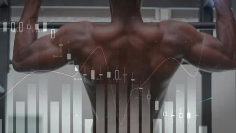 Man gripping pull-up bar and pulling upward in gym for strength, finance charts Stock Footage 331108525