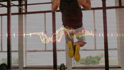 Man gripping pull-up bar initiating repetitions in gym, waveform tracking pulls Stock Footage 333019475