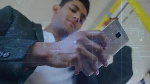 Man gripping yellow strap in subway tapping phone screen analyzing data via tech Stock Footage 314654692