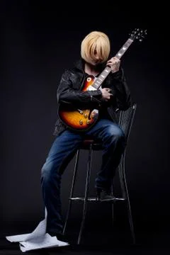 Man - guitar player cosplay anime character Stock Photos