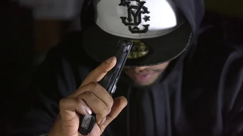 Man With Gun in Deep Thought Stock Footage 83838874