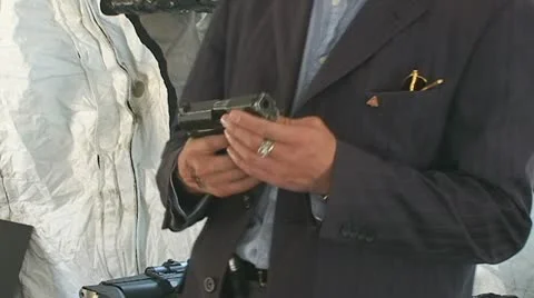 Man with gun 스톡 동영상 10833400