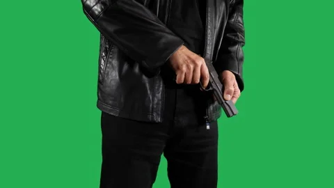 Man With Gun on green background Stock Footage 242381445